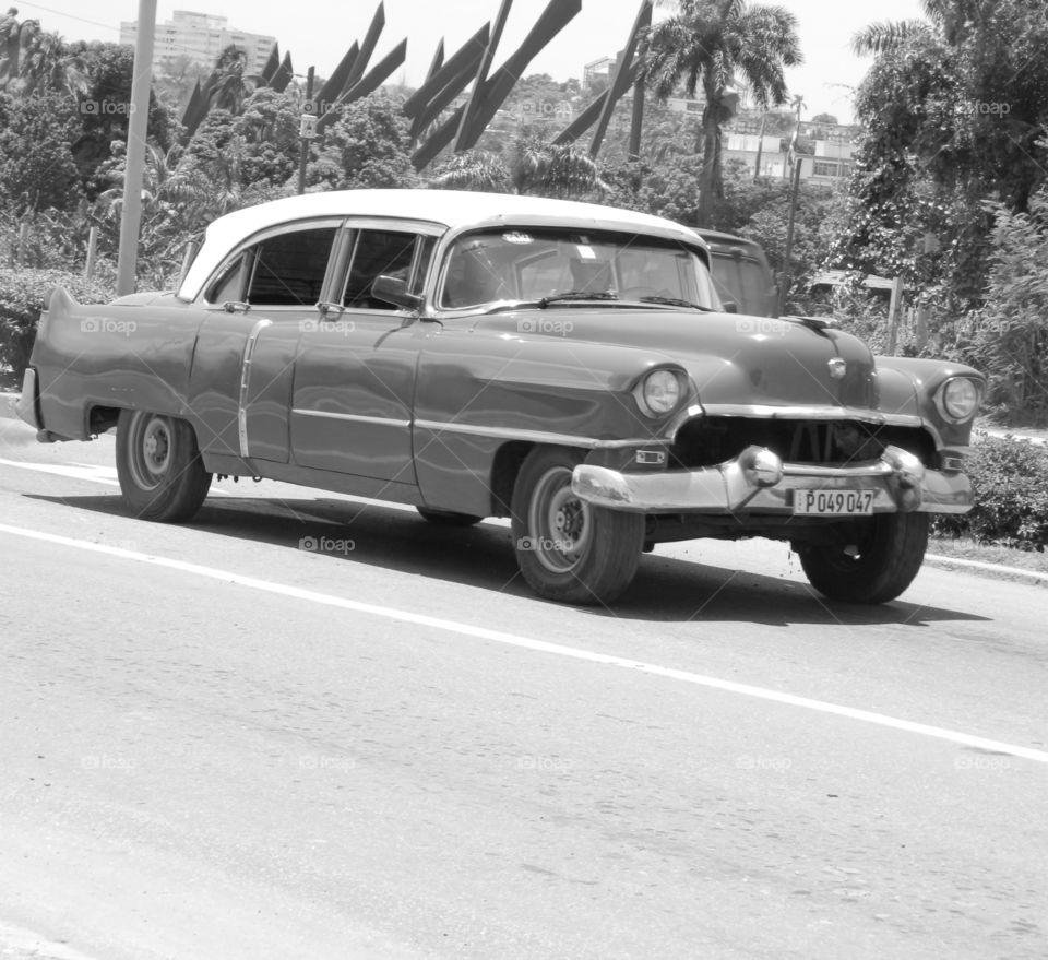 Cuba: Cadillac! As I see Santiago de Cuba in black and white, and sometimes in color! Cuba is a special destination and people know how to enjoy themselves, despite obvious signs of poverty and hardships. The streets are filled with vibrant colors and rhythm and it is not uncommon to see people dancing in the streets and alleys to the sound of loud salsa music! Wish I could, but It's impossible to capture it all! 
