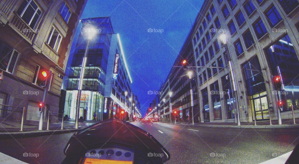 Rising a motorcycle through the city at night
