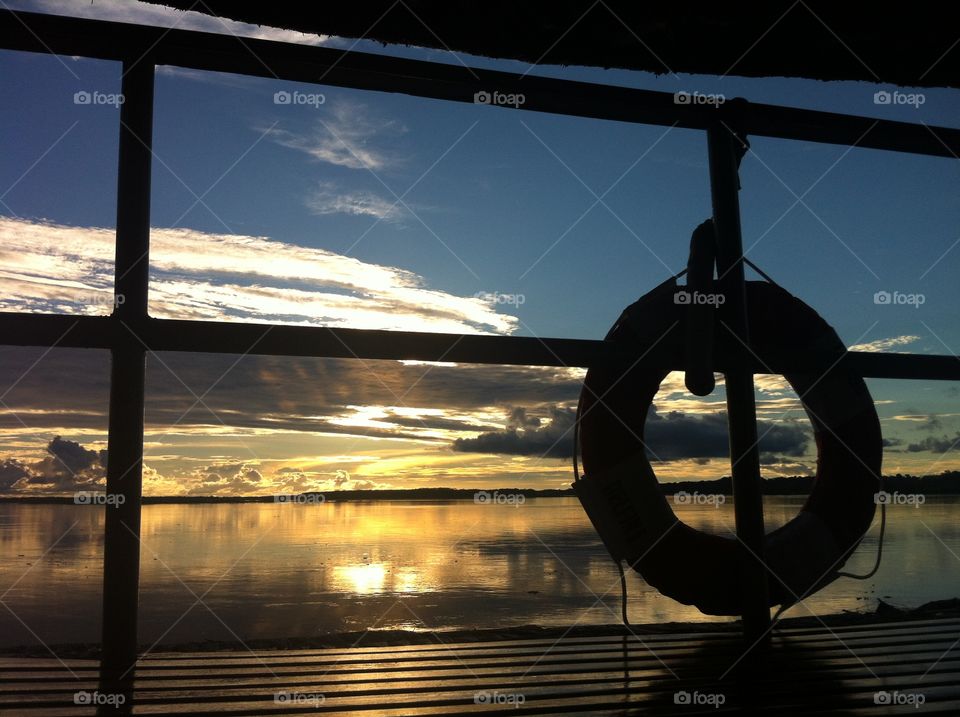 Sunset view from a boat on the Amazon river in Peru