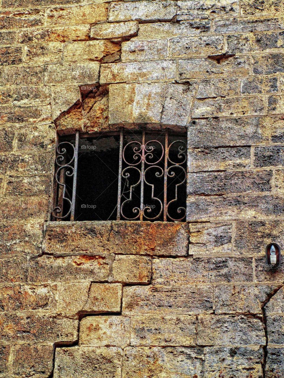 rusty grill. metal rusty grill in an old facade