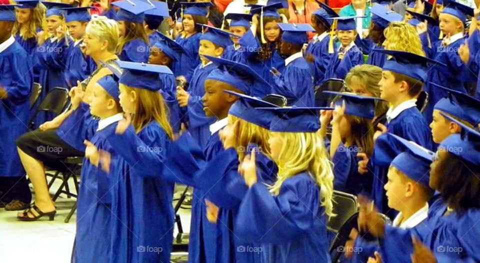 Group of students wearing mortarboard and gowns