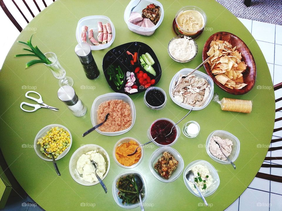 Thanksgiving holiday leftovers laid out on a table top