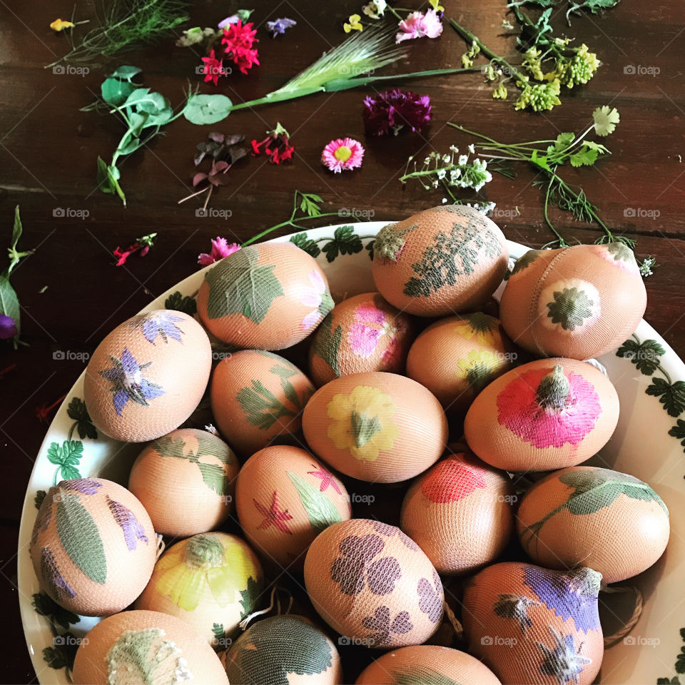 Easter eggs ready for dyeing in Cyprus.  Eggs are covered with flowers and leaves which act as a stencil when they are boiled in a traditional madder dye.  They are then wrapped in bits of stocking to keep the flowers and leaves in place.  