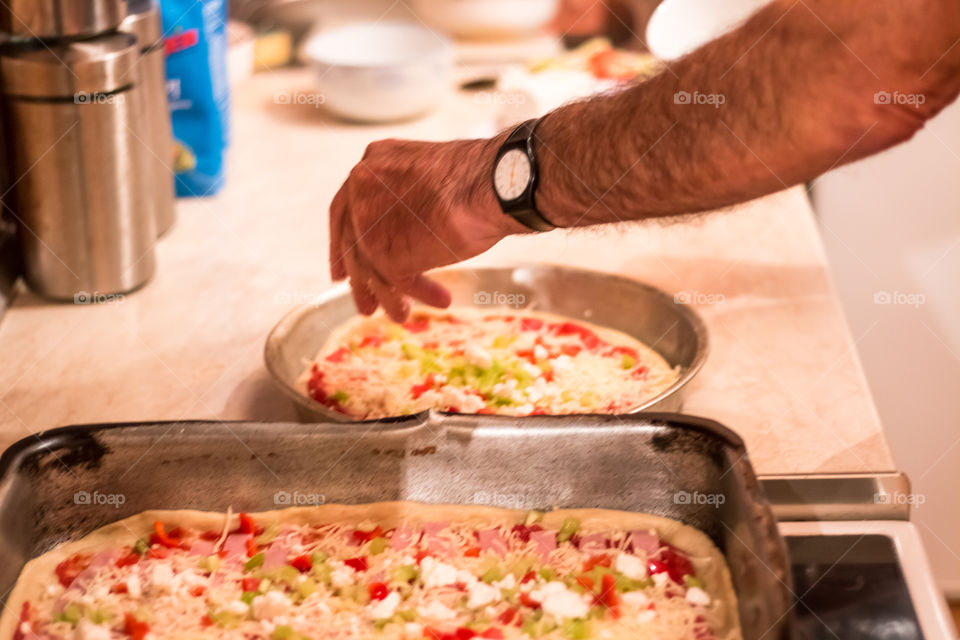 Man Prepares And Cooking Pizza At Home
