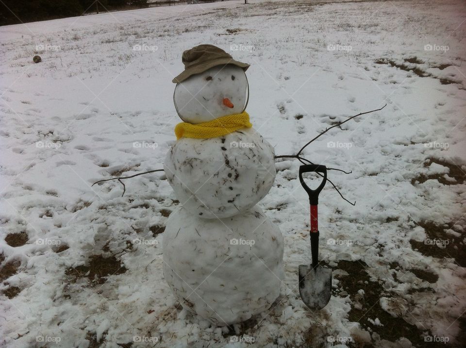 Snowman. Snowman with shovel