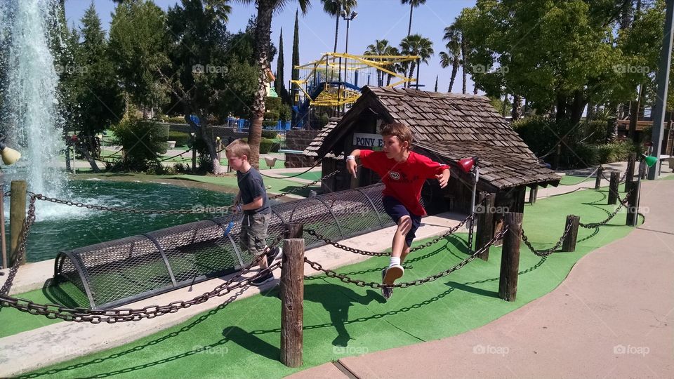 mini golf. caught jumping the ropes