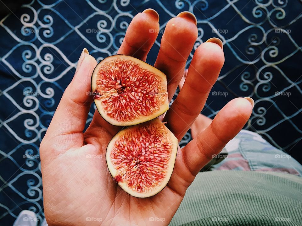 Woman holding pomegranate