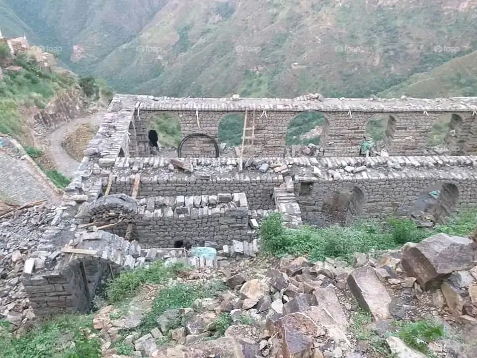 A stunning view of green mountains covered in fog in Yemen