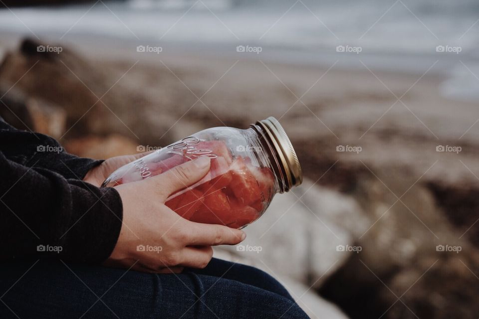 hands holding jar of watermelon rustic aesthetic 