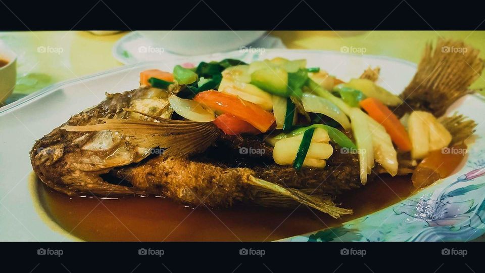 Fried fish savouring sweet and sour sause