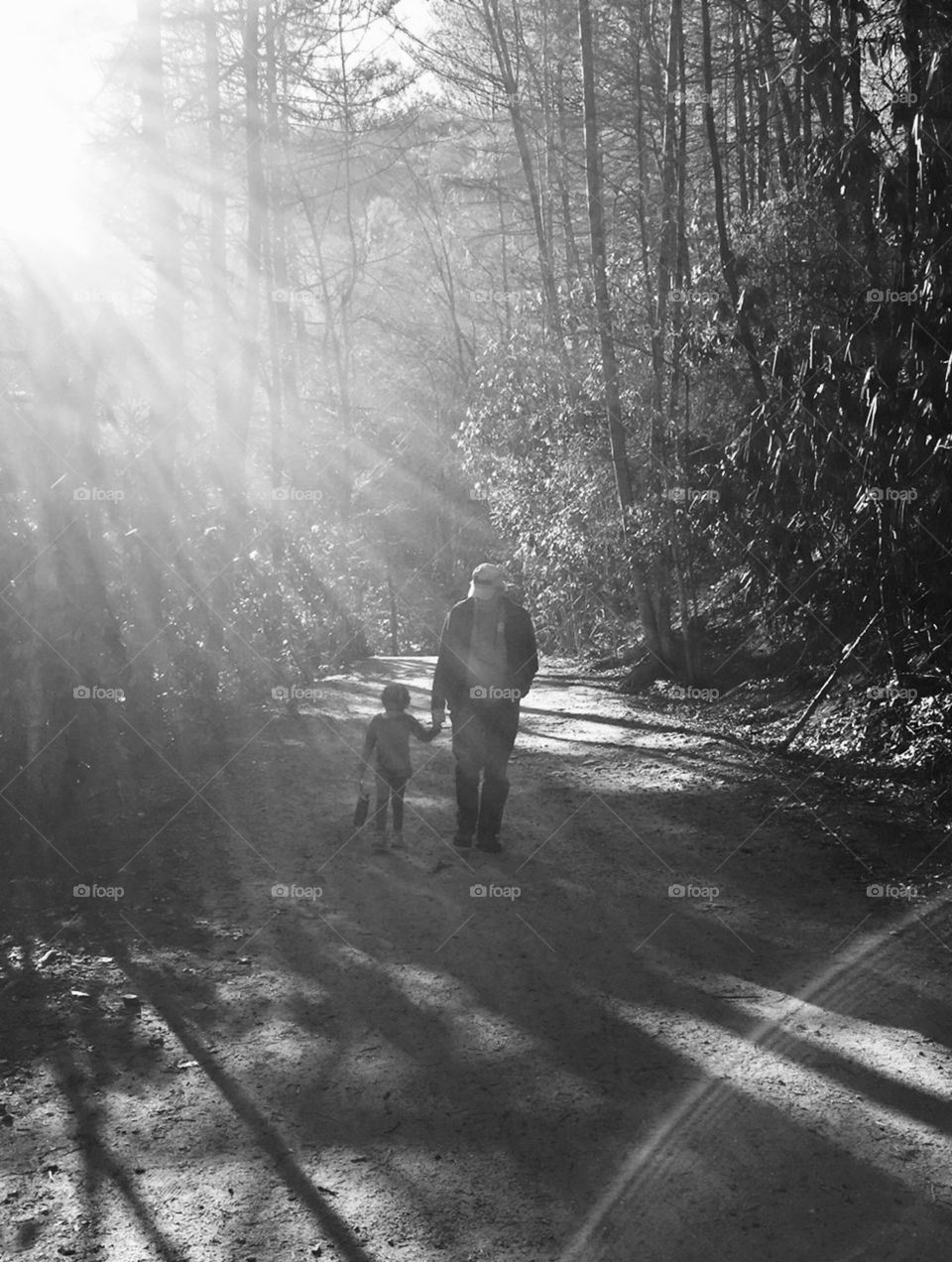 Grandfather and granddaughter walking
