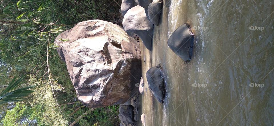 This big rock is in the middle of the river