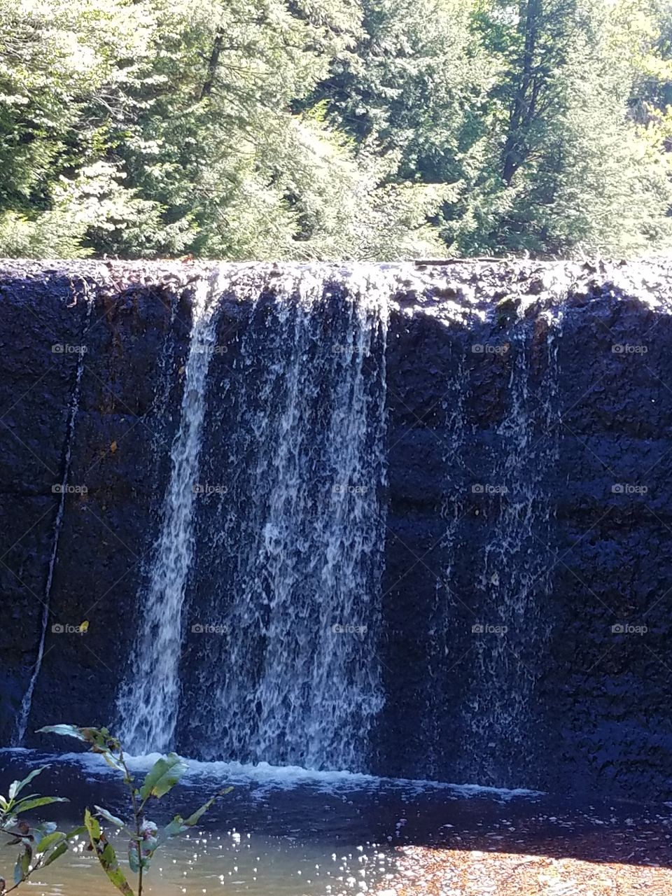 water works dam with waterfall
