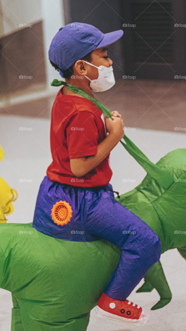 boy on an inflatable custome