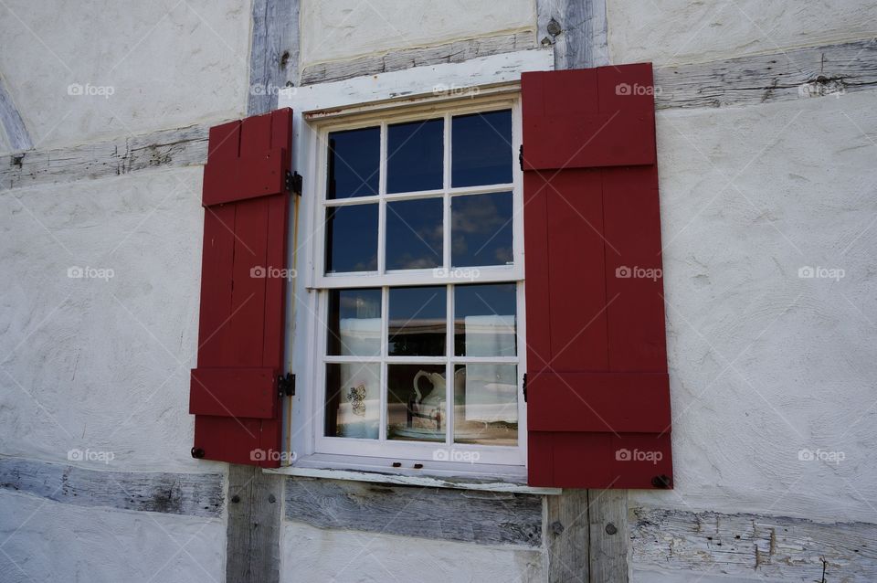 Historic Old Farmhouse. Red Shutters on Germanic Style Half-Timber Farmhouse Built ~ 1865