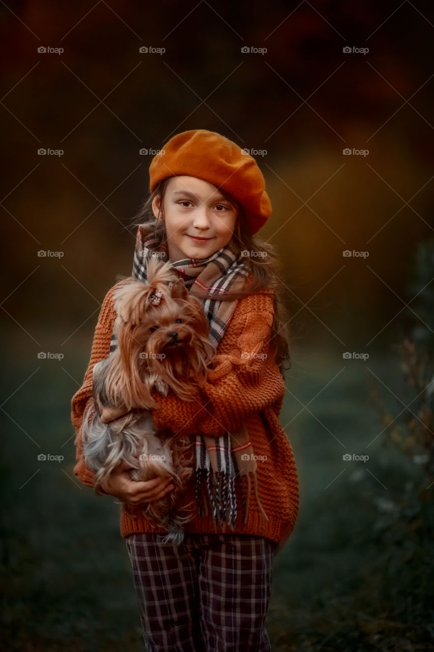 Little girl with dog outdoor portrait 