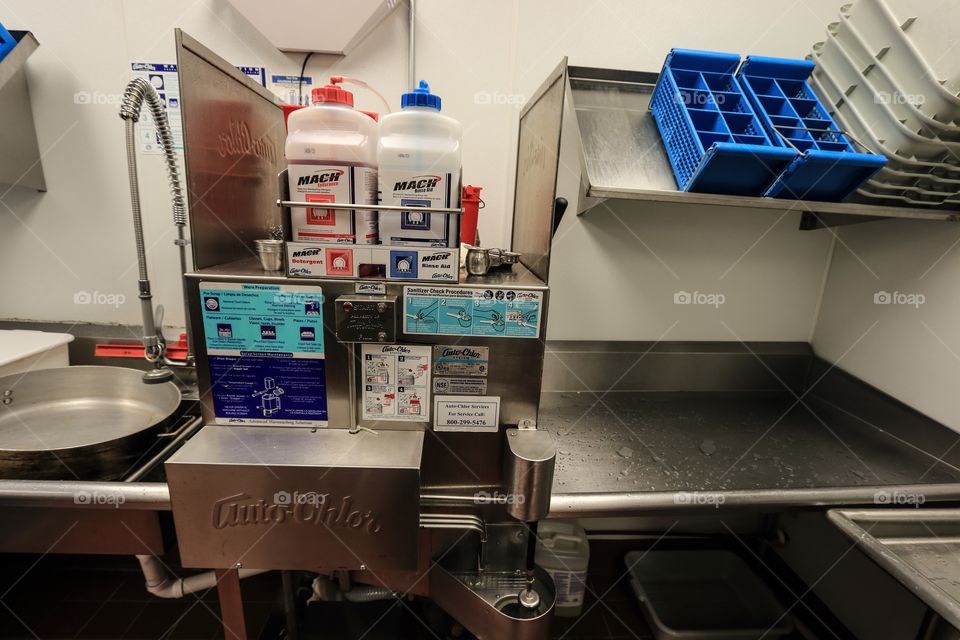 Kitchen storage cleaning equipment inside the restaurant 