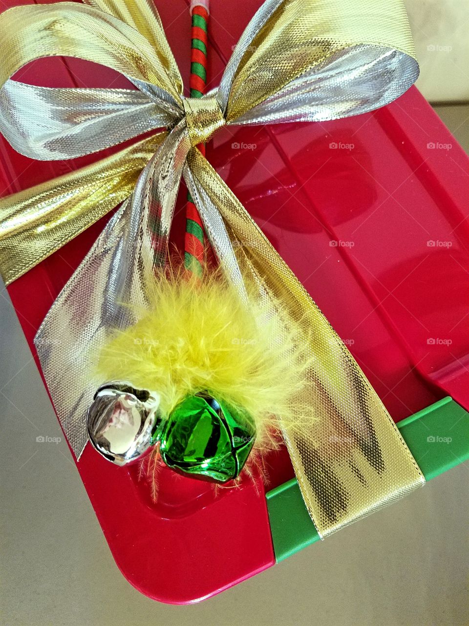 Bright Colors and Jingle Bells adorn a Christmas package!