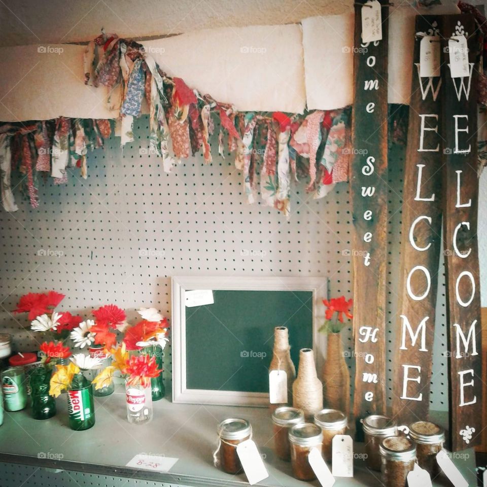 Gift store shelf display crafts, Welcome sign, fabric garland.