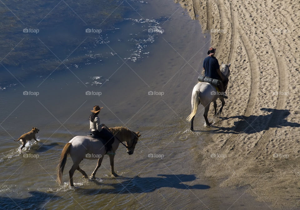 Riders crossing the river