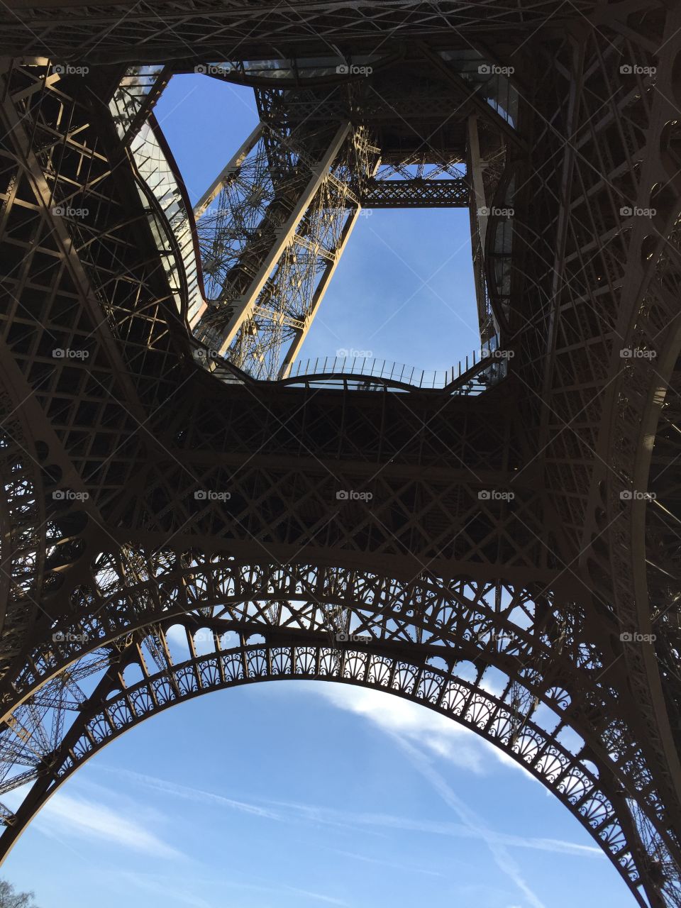 The Eiffel Tower bottom view filters out the blue sky