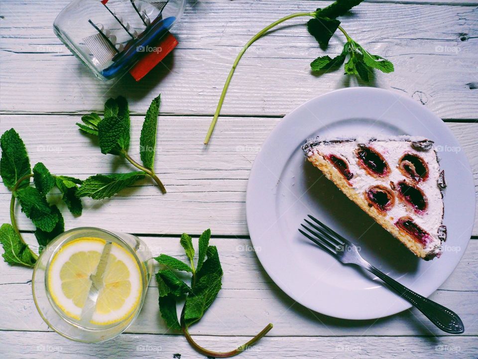 cherry cake, lemonade with mint on the table