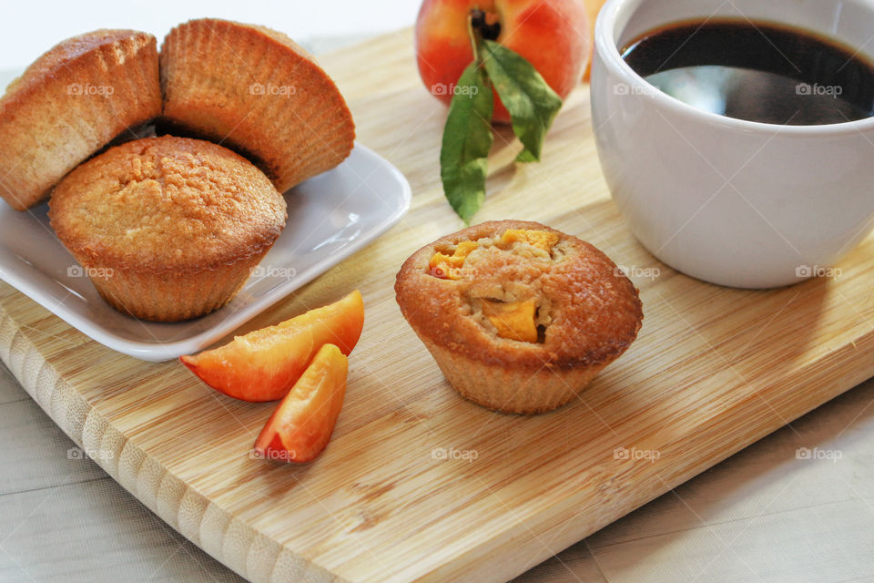 cup of coffee with peach muffins