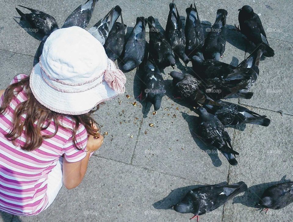 Girl with a pigeons