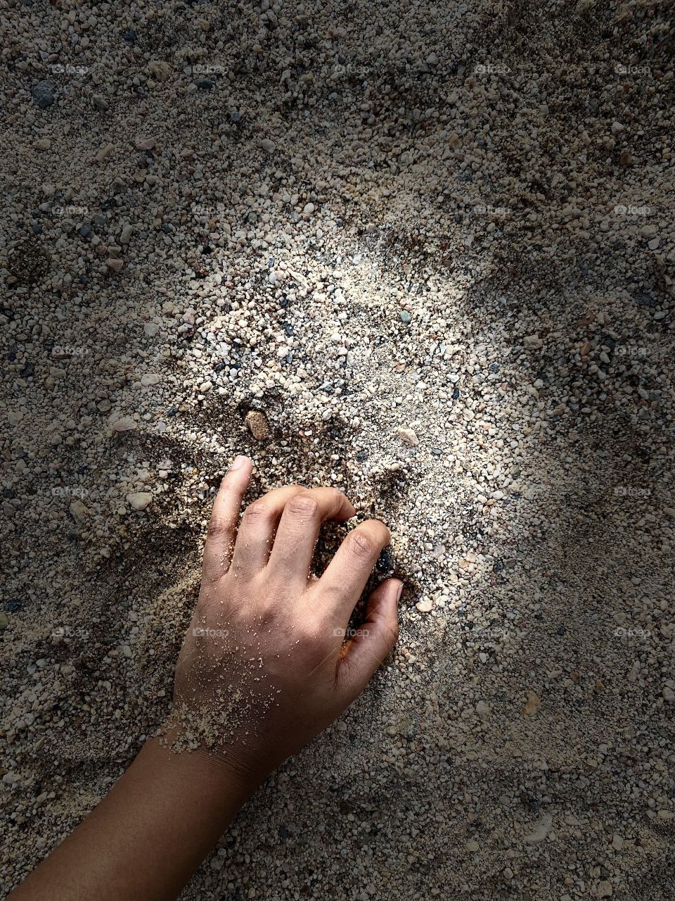 When we visited our village, my sister's first outing was playing with soil and water