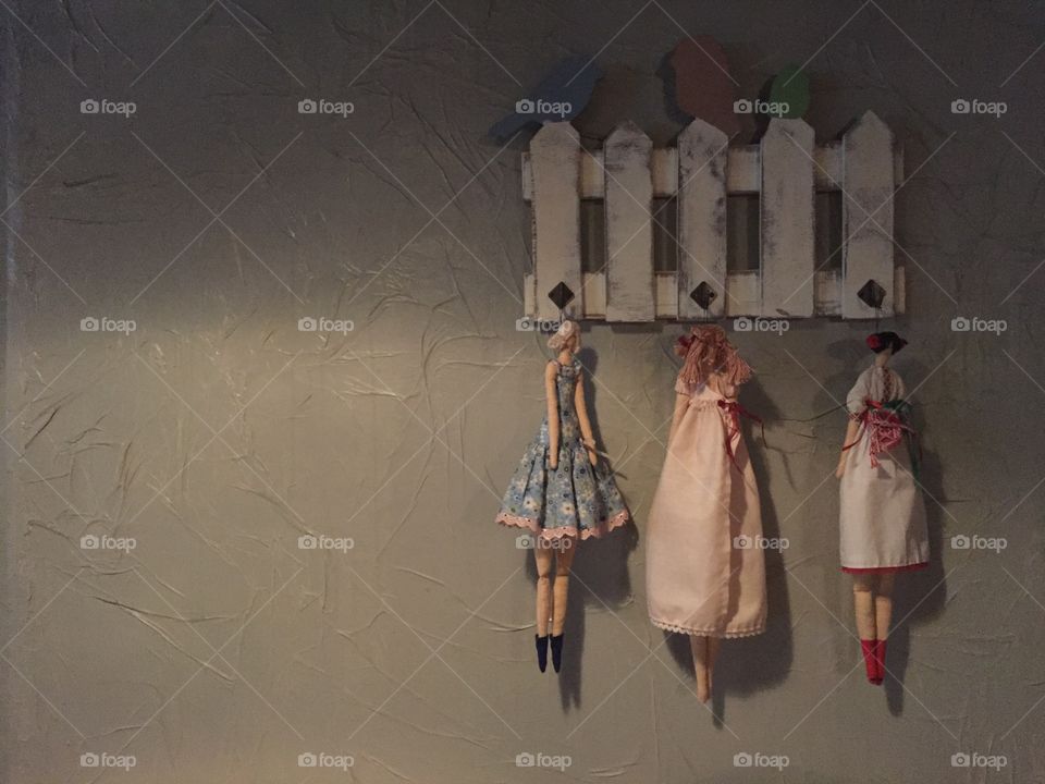 Dolls hanging on the wall