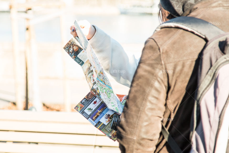 Tourists On The Street Reading A Map
