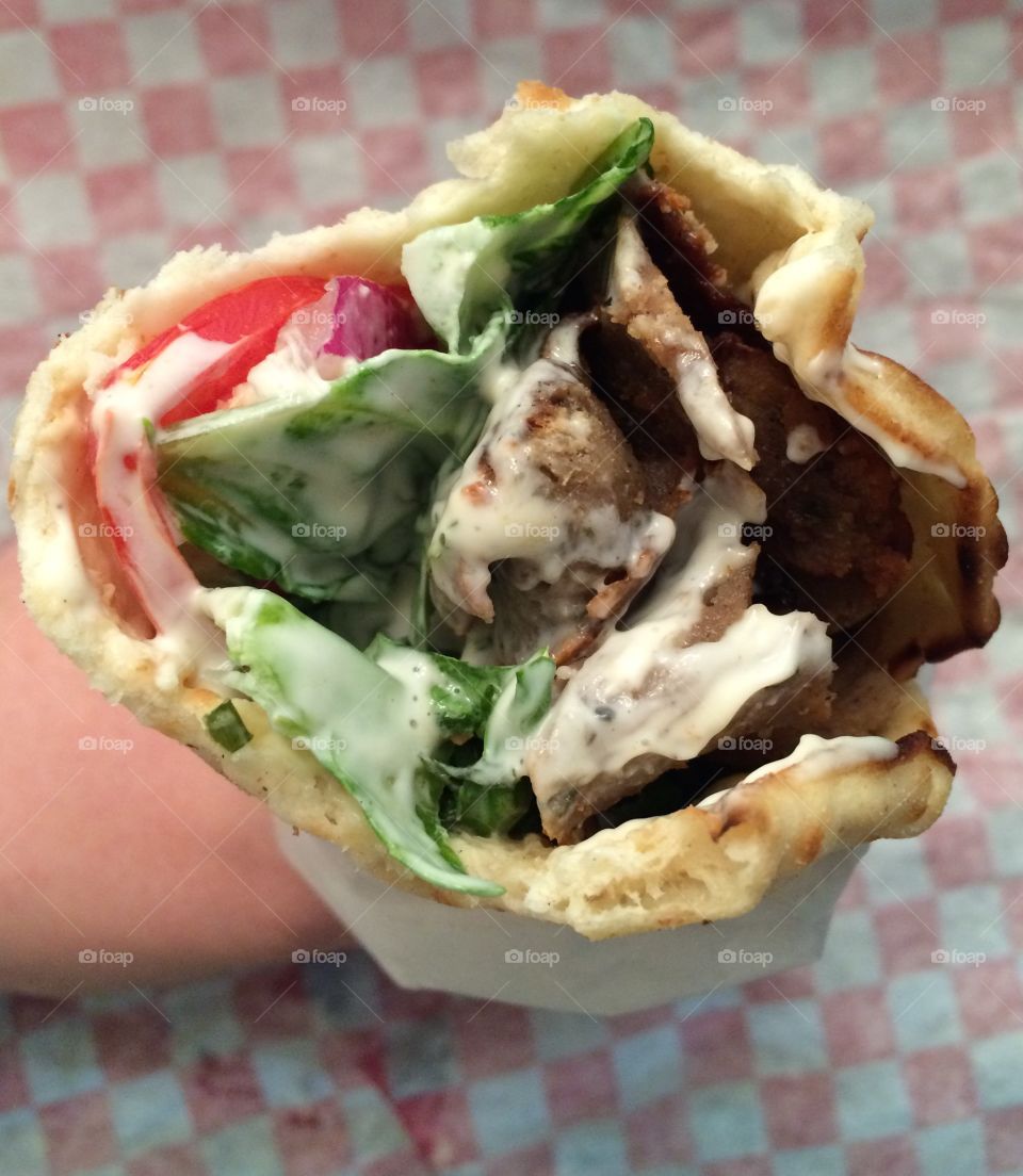 Close-up of person's hand holding kebab