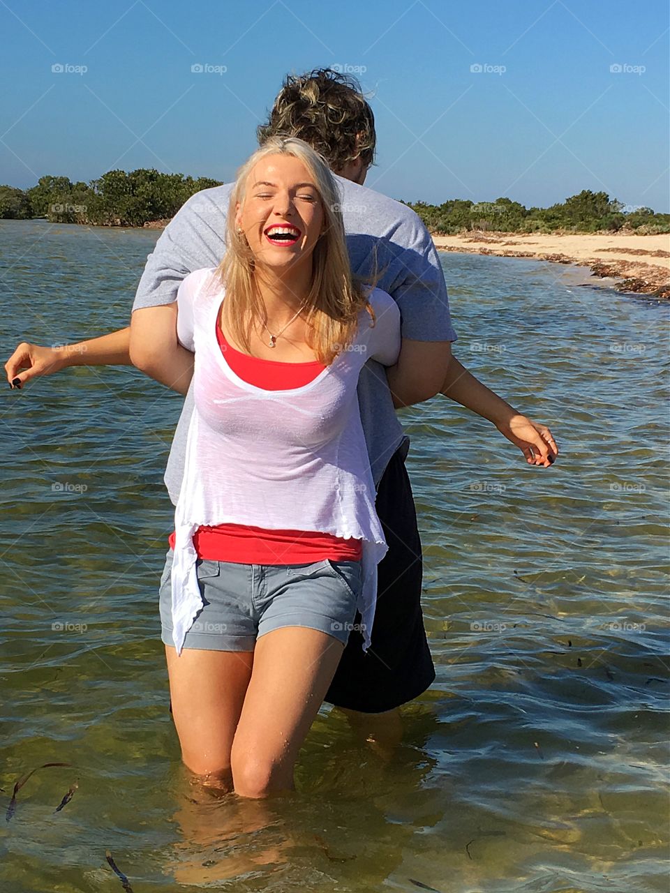 Young couple enjoying in sea