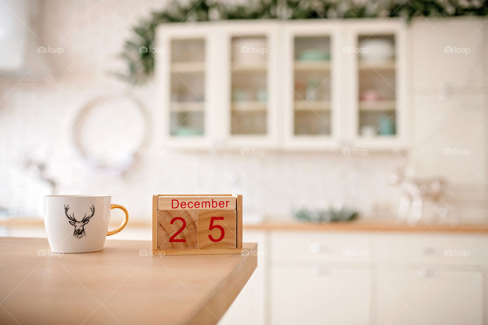 Christmas background with wooden block calendar with the date of December 25