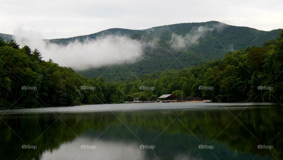 Beautiful mountain lake with mountain and cloud reflections on water at Vogel state park in Georgia