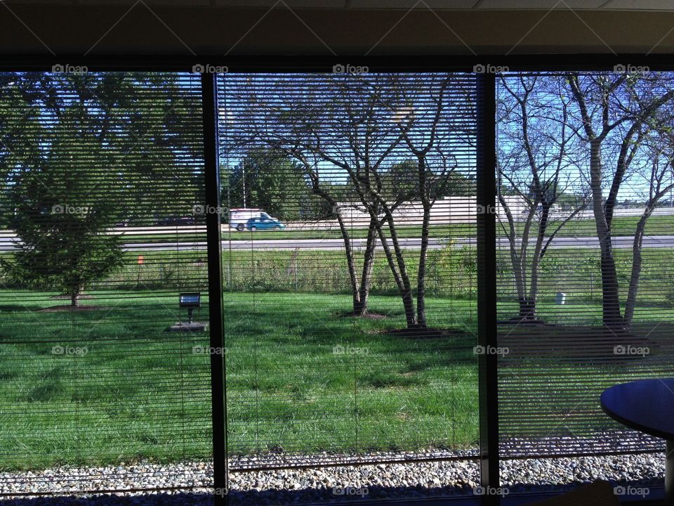 View of the highway and traffic from inside an office building