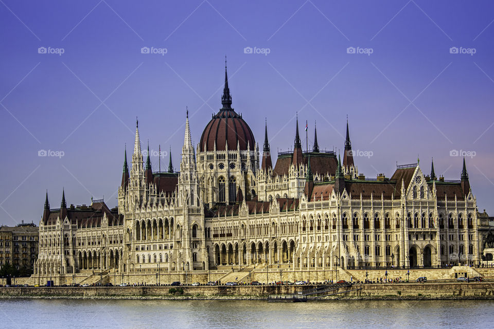 Close up shot of the Hungarian Parliament building from the Danube side, on a clear summer day.