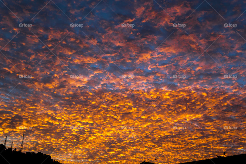 Sunset in the sky with golden clouds