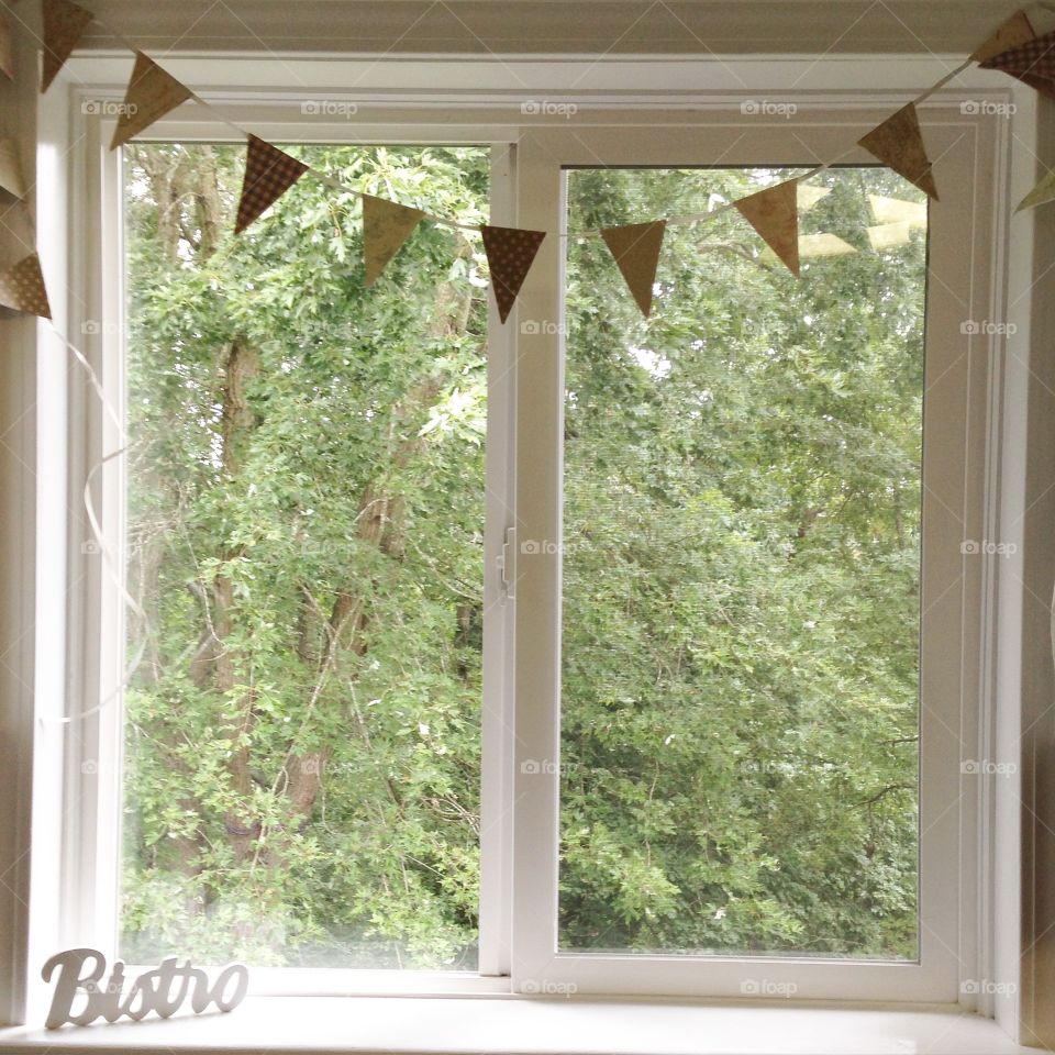 Kitchen window with bunting. 