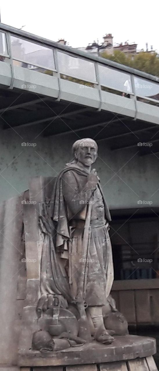Statue at the base of Bridge, Paris