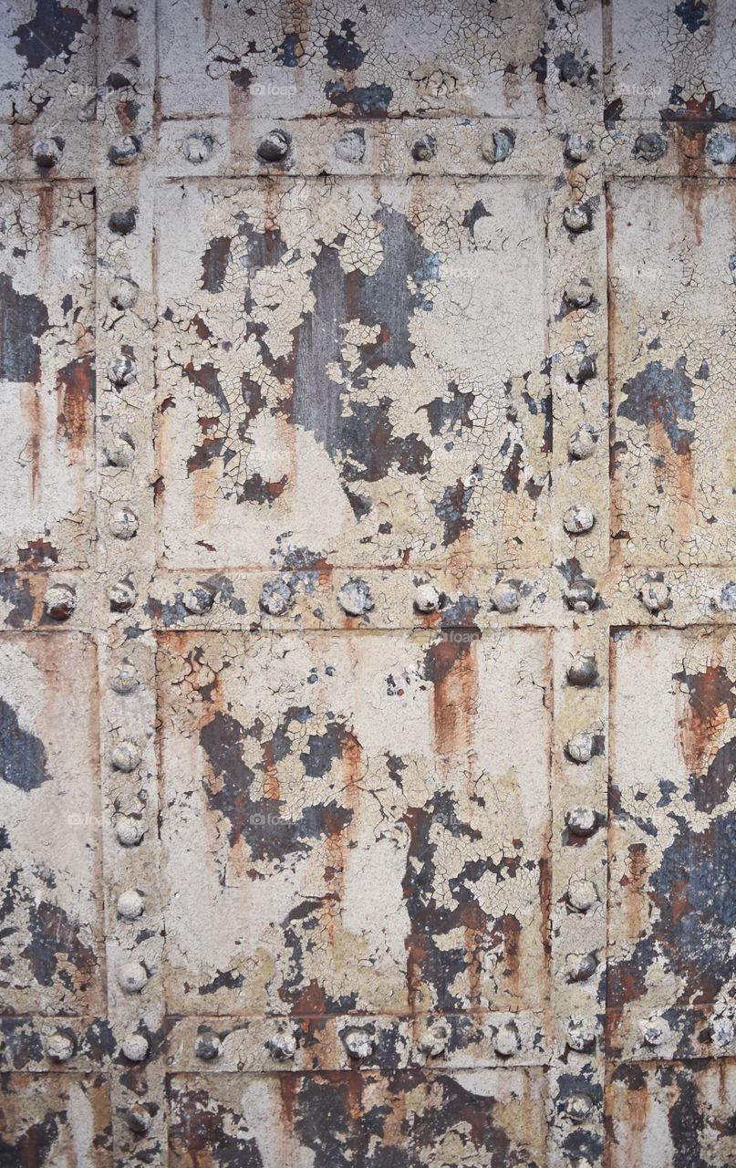 Detail of metal door with peeling paint