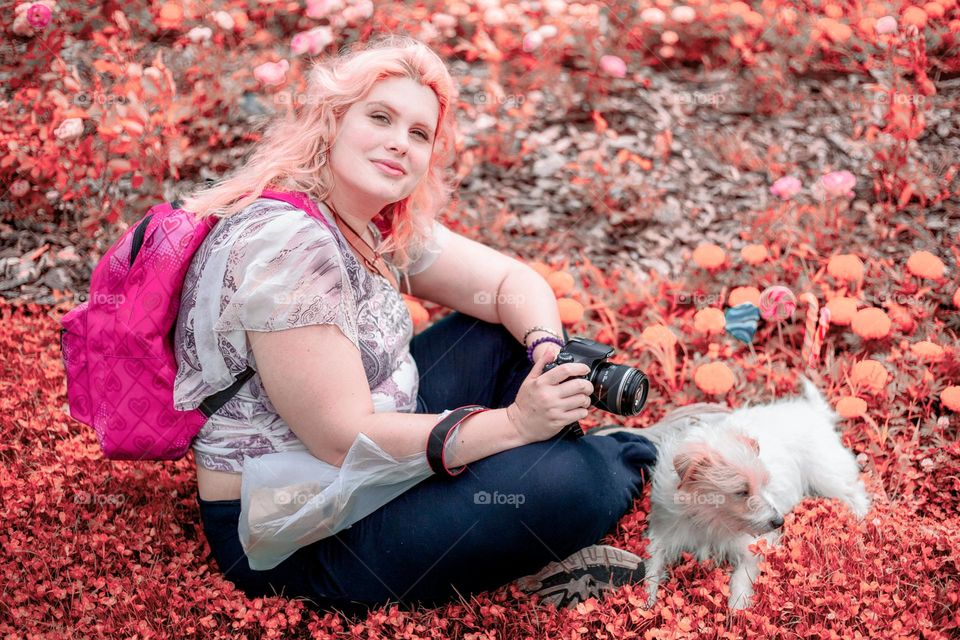 at the field lady and a dog