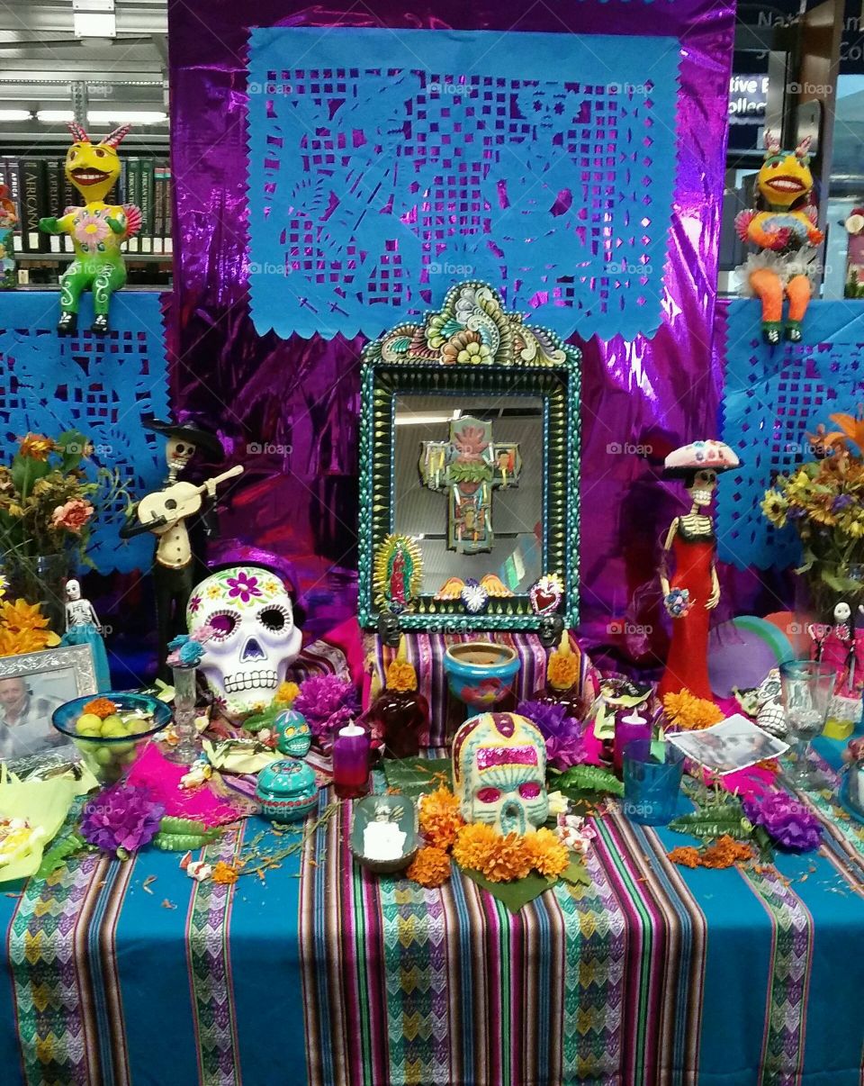 celebrating Dia de Los Muertos building alters. This one on display is located at our local library.