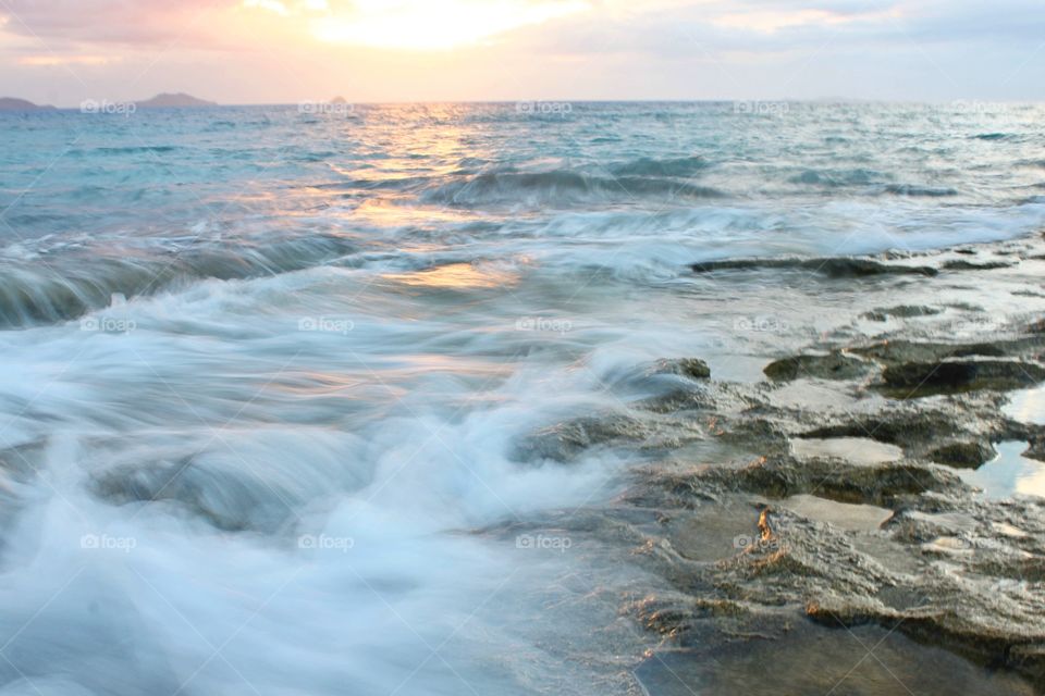 Flowing waves passing through the rocks