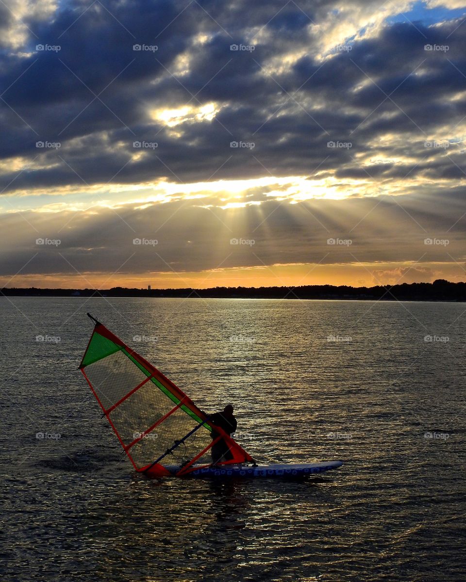 Windsurfer in sunset