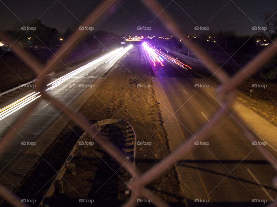 Car lights streaking. I also caught an ambulance in this photo.