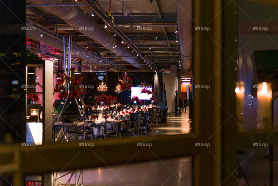 Looking through a window at a holiday party