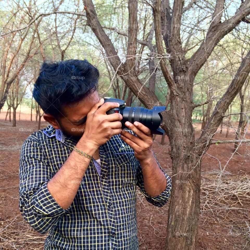 Man taking photograph with camera