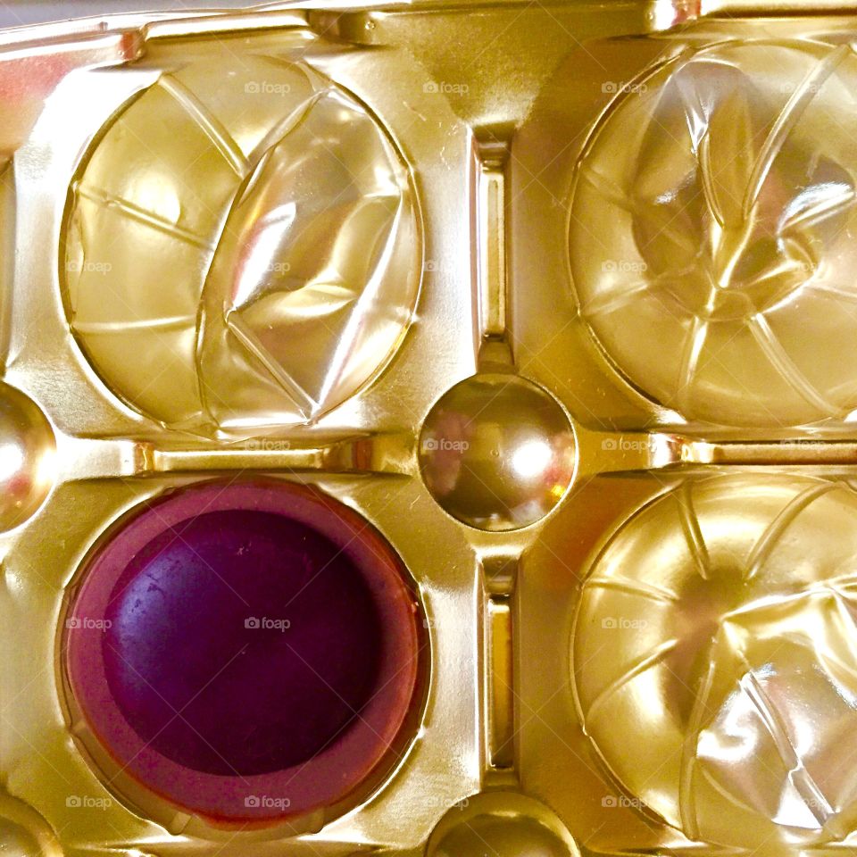 Chocolate candy in gold wrapper 