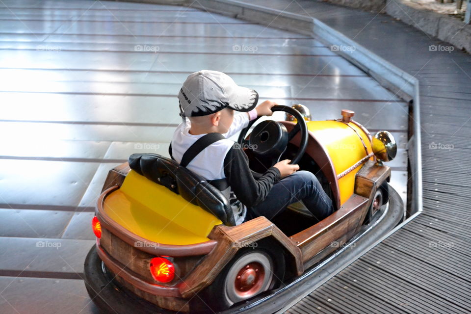 Boy driving a bumper car